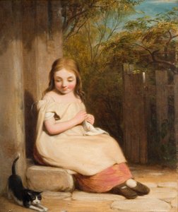 子猫を持つ少女